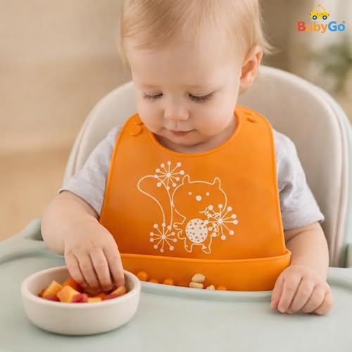 Image of BabyGo Silicone Baby Bib for Feeding & Weaning Infants & Toddlers |Waterproof, Washable & Reusable | Adjustable Neckline, Lightweight & Foldable Bib with Deep Food Catcher Pocket |Orange (Pack of 1)