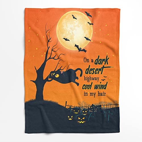 Black Cat on a Dark Desert Blanket