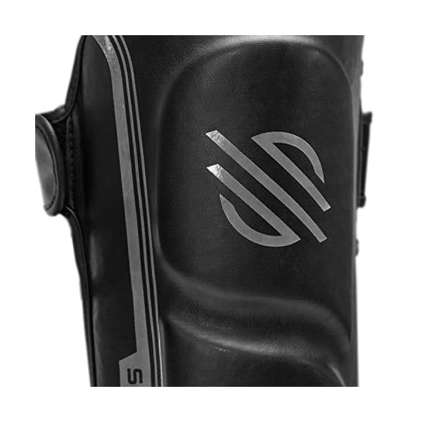 Sanabul-Core-Advanced-Series-Hook-and-Loop-Strap-Kickboxing-Muay-Thai-MMA-Shin-Guards Sanabul Core Advanced Kickboxing Shin Guards | High-Impact Foam, Ergonomic Design, and Secure Hook and Loop for Optimal Training | Muay Thai Shin Guards for Adults and Children (Gunmetal, L/XL)