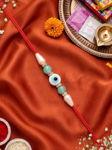 Image of Karatcart Stylish Light Blue Beads Evil Eye Handmade Rakhi for Brother with Roli & Chawal