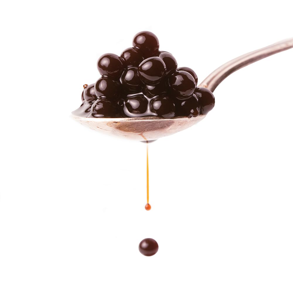 Perles de Vinaigre de Modène Gourmet pour Vinaigrette ou Décoration pot 200gs. Les sphères de vinaigre de Modène dans son intérieur liquide explosent dans la bouche lorsqu'elles sont mordues.