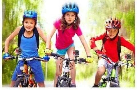 Three children on bicycles, each wearing a helmet with an Explore One action camera mounted on it.