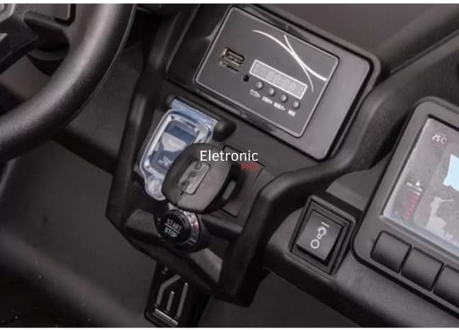 Close-up of the electric buggy's start button and key slot.