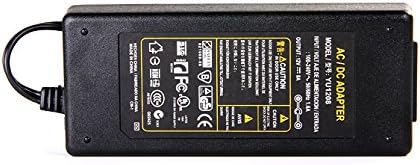 Close-up image of the power supply adapter's label showing input and output specifications.