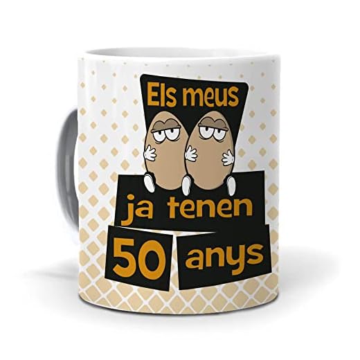 mundohuevo Taza Regalo 50 cumpleaños Hombre en Catalan ELS meus Ous ja tenen 50 anys. Ceramica AAA - 350 ml.