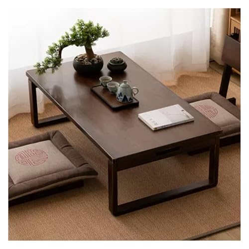 Petite table basse pliante noire pour gagner de la place studio
