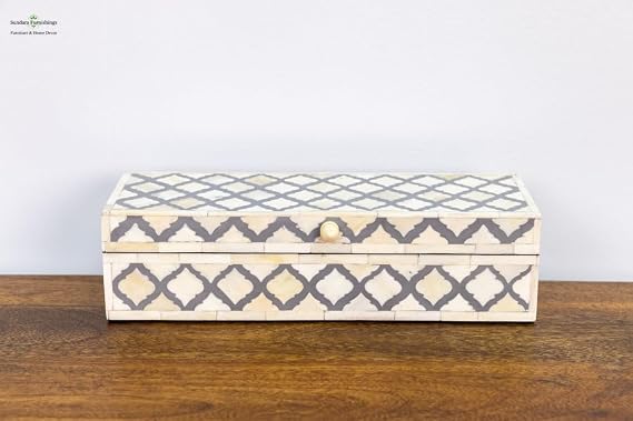 Gray and white long rectangle bone inlay box with geometric pattern.