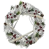 Der Tischkranz ist aus weiß gekalktem Schilf und Rattan das auf ein Metallgestell geflochten wurde