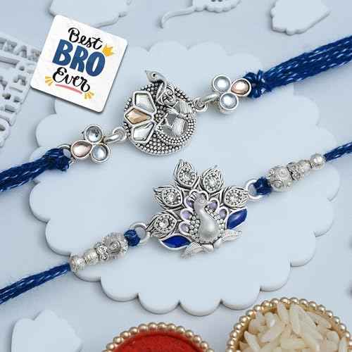 Image of eCraftIndia Beautiful Peacock Lord Krishna Playing Flute Designer Rakhi Set of 2 | Rakhi for Brother Bhaiya Bhai with Best Bro Ever Fridge Magnet | Roli Chawal Pack