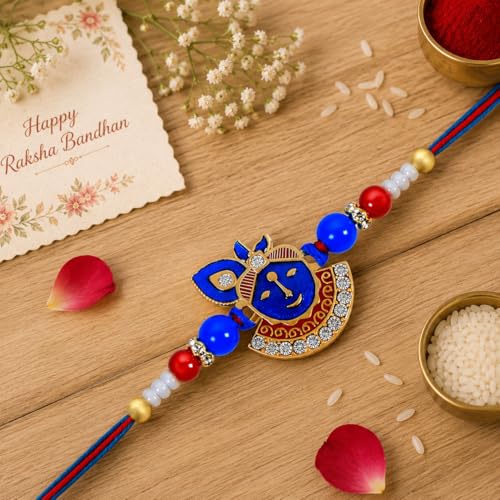 Image of Riddhika Ventures Religious Gold Plated Meenakari Sacred Ganesha Rakhi with Roli Chawal and Greeting Card
