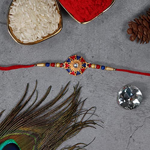 Image of DeoDap Ganesh Design Mina Beads Rakhi Coated with Chocolate, Silver Pooja Coin, Tilak Set, Greeting Card - Rakhi Gift for Brother