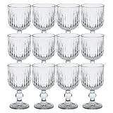 Elegancia y estilo clásico se unen en este set de 12 copas de cristal de San Ignacio, diseñadas para vestir tu mesa con distinción. Con un tallado tipo vintage en relieve geométrico y forma alargada con pie, son ideales para brindar en cualquier ocasión.