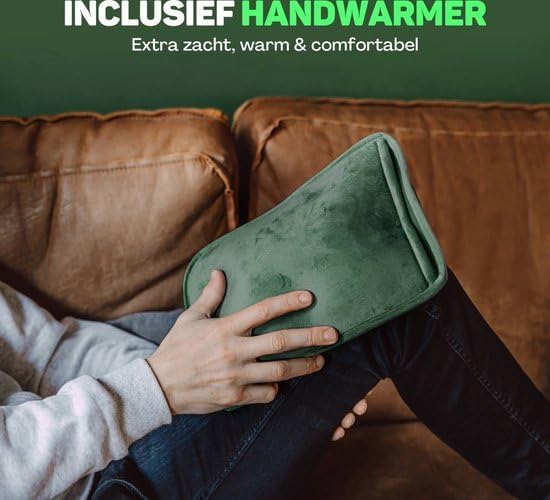 Person holding the green hand warmer pouch on their lap, hands inside.