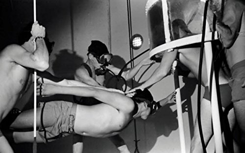 BUDS dive tower instructors transfer a student from a roving bell in preparation for swimming ascent training Poster Print by Michael WoodStocktrek Images (17 x 11)