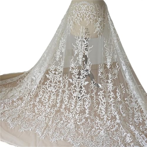 Tissu en tulle brodé ivoire à paillettes idéal pour confectionner votre robe de mariée de rêve