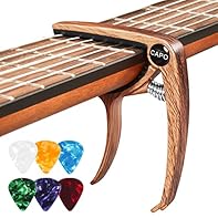 Capo for guitar: 1 capo made of high-quality metal, with 6 pieces guitar picks in different colours, a good capo makes it easier to make, capo size 7.5 x 9 x 1.3 cm, pick size 25 x 30 x 0.71 mm. Unique design: the capodasta is designed with U-shaped ...