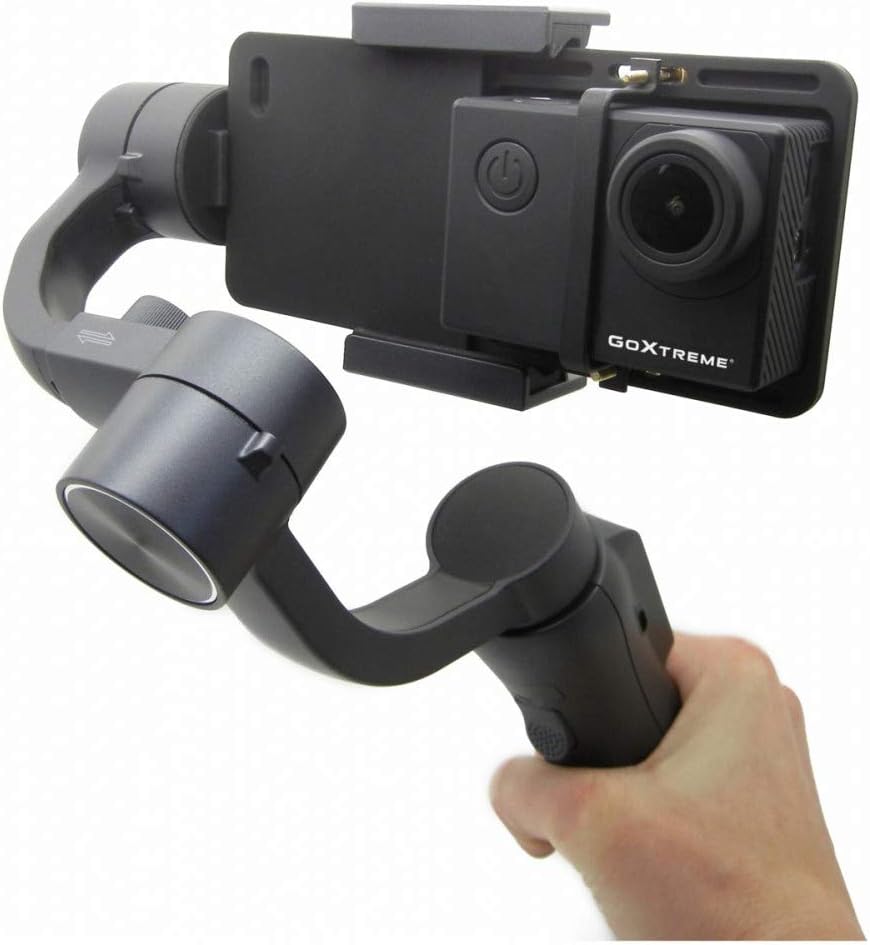 GoXtreme GX1 Dual Gimbal with an action camera mounted, held in a user's hand.