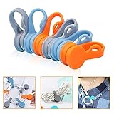 Las bridas de silicona suave no solo pueden funcionar como organizador de cordón / clips de cordón / soporte de auriculares/clips de marcador de papeles/llavero/pizarra magnética, sino que también pueden sujetar llaves/papel u otras cosas a cualquier lugar, como pizarra, nevera