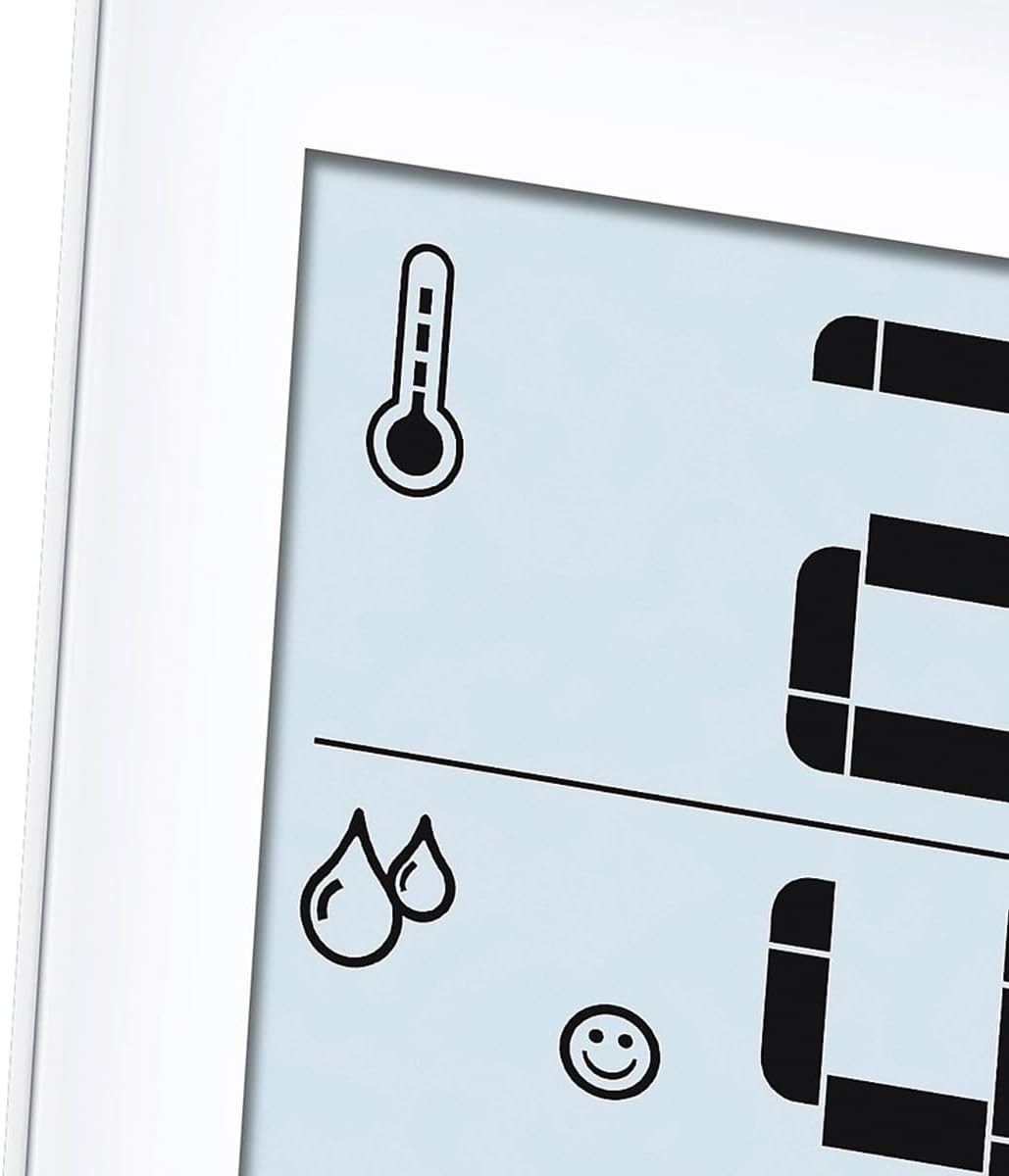 Close-up of the Beurer HM16 display showing temperature and humidity icons, and a smiling face comfort indicator.