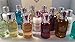 Produktbild Molton Brown, Minireiseset, 8 teilig, 8 x 30 ml Body Wash/Body Lotion, Ausgewählt aus aktuellem/saisonalem Bestand
