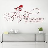 KLEBEHELD® Wandtattoo Herzlich Willkommen bei uns Zuhause | Spruch mit Schmetterling … Größe 58x26cm, Farbe schwarz