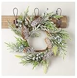 Bring the beauty of nature into your home with this Artificial Berry Pine Cone and Frosted Pine Candle Ring. With berries, natural sugar pine cones, and sprigs of artificial pine, it can be used as both a candle ring or small wreath. It brings a touc...