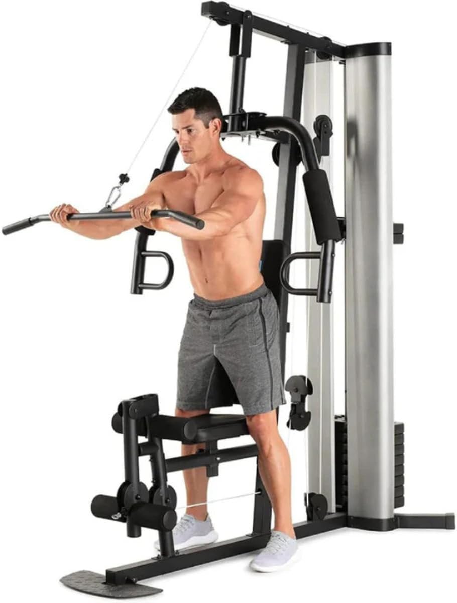 Man performing chest press exercise on the multi-gym.