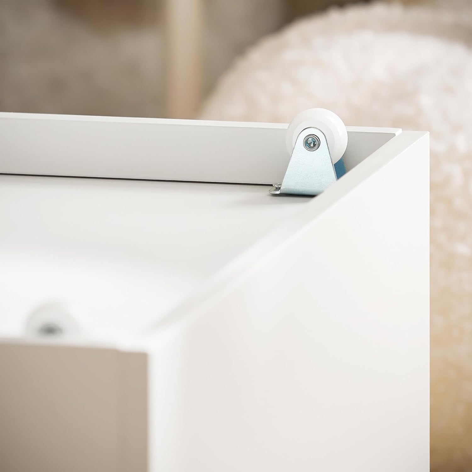 Close-up of a wheel on the bottom of a storage box for the SoBuy KMB66-W bench