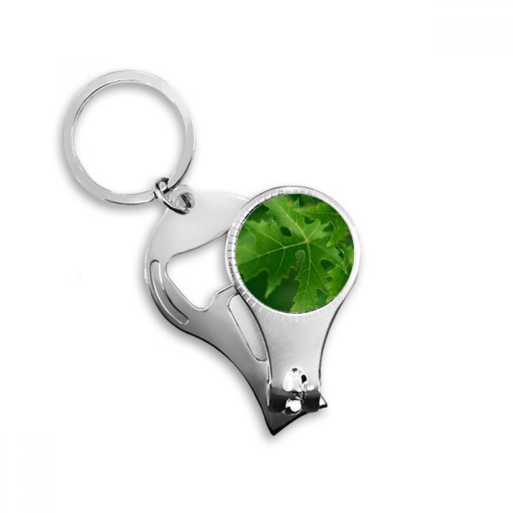 Pince à ongles avec décapsuleur intégré et anneau porte-clés motif plante verte