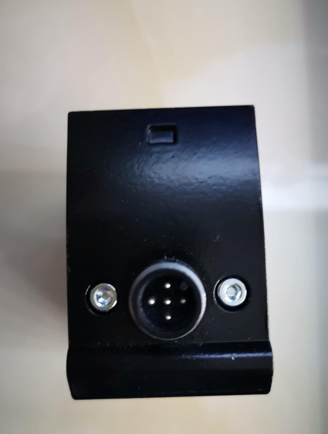 Bottom view of SICK DT50-P1113 sensor showing electrical connector