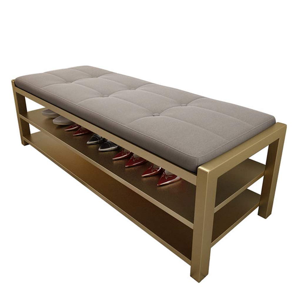 Banc de rangement rembourré gris pour en finir avec le désordre des chaussures dans l'entrée