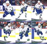 2024-25 Upper Deck Extended Series Vancouver Team Set of 12 Cards: Jake DeBrusk(#631), Filip Hronek(#632), Vincent Desharnais(#633), Carson Soucy(#634), Kiefer Sherwood(#635), Danton Heinen(#636), Elias Lindholm(#686), Quinn Hughes(#689), Thatcher Demko(#690), Elias Pettersson(#693), Brock Boeser(#695), J.T. Miller(#697) - Sportscard Superstore