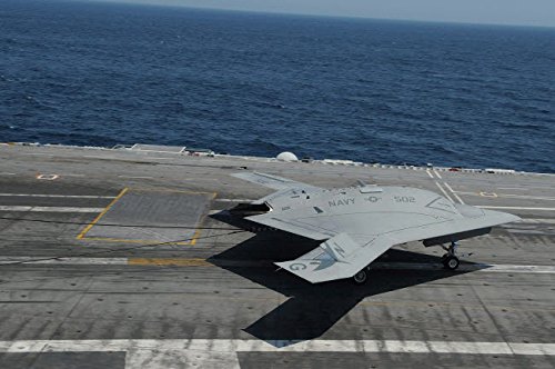 An X-47B Unmanned Combat Air System makes an arrested landing Poster Print by Stocktrek Images (34 x 22)