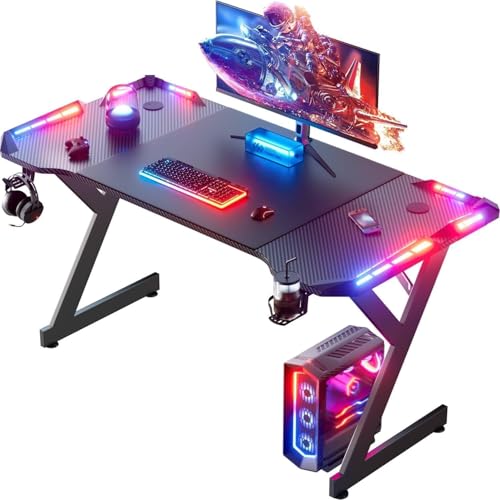 Image of HLDIRECT 47 Inch Gaming Desk with LED Lights, Ergonomic Computer Gaming Table with Carbon Fibre Surface, Sturdy PC Workstation Desk for Home Office with Headphone Hook, Cup Holder, Black