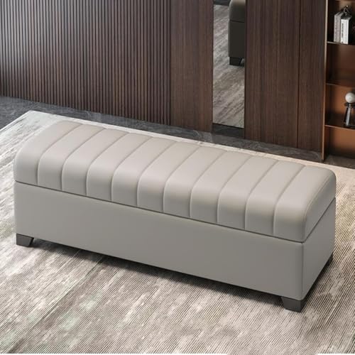 Pouf de chambre gris clair et meuble de rangement pour chaussures
