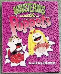 Paperback Ministering With Puppets Book