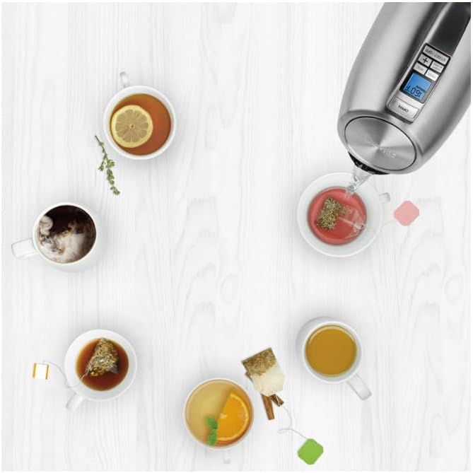 Cuisinart PerfecTemp Kettle pouring hot water into multiple tea cups