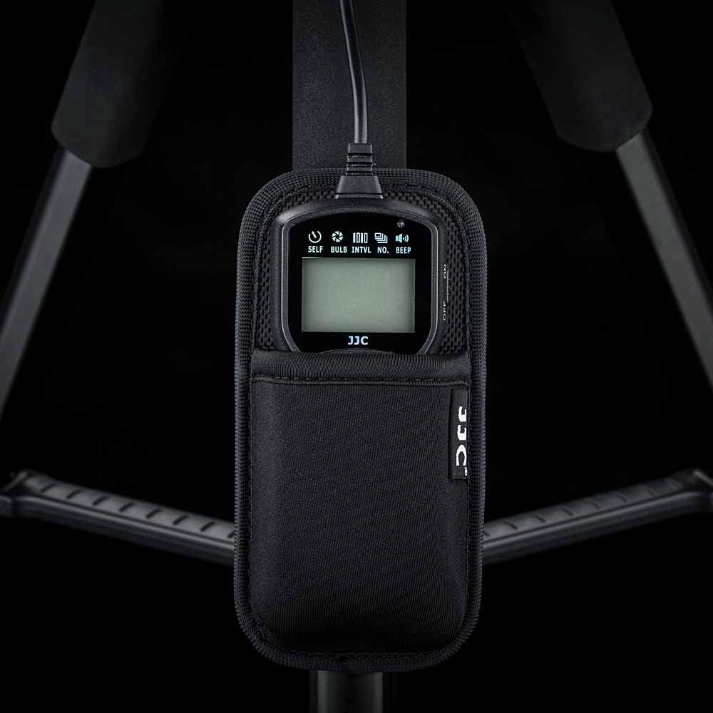 Remote control in holder strap on a tripod, ready for use