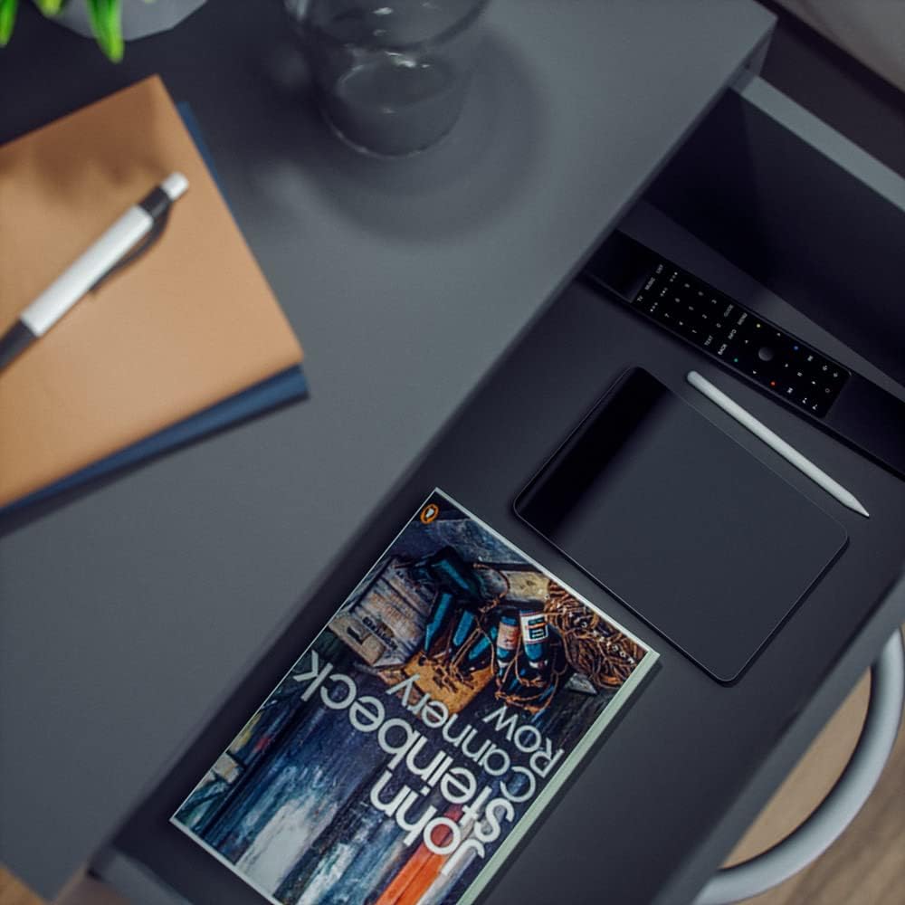 Close-up of the Casaria Kiel Nightstand drawer, showing a tablet, remote control, and book inside