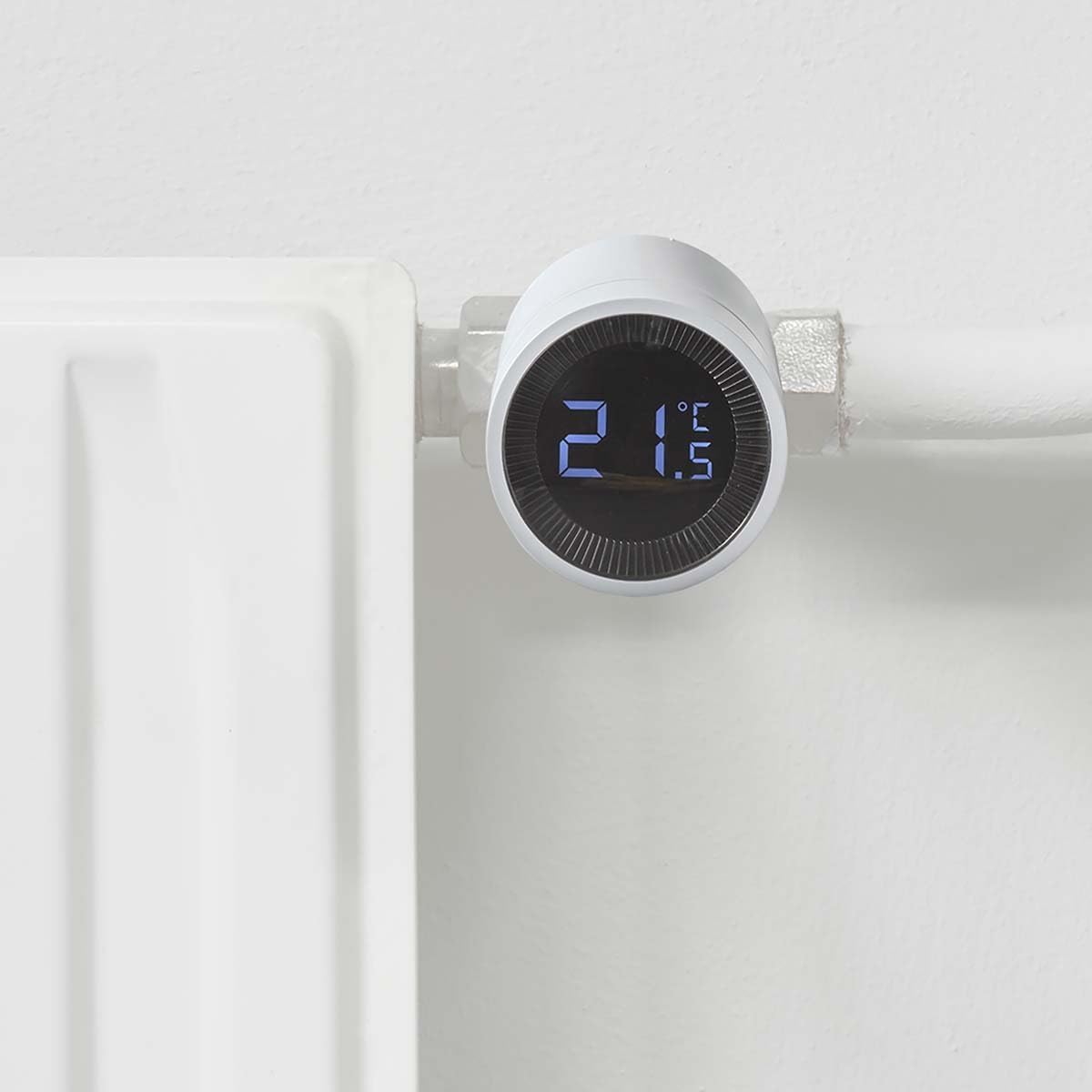 Nedis ZBHTR10WT ZigBee Radiator Thermostat installed on a radiator valve