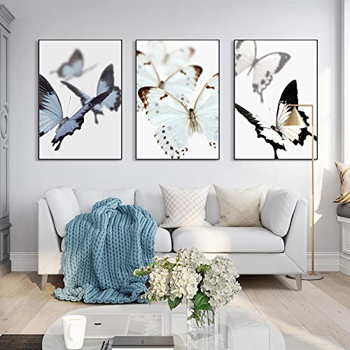Peinture papillon bleu sur toile pour décoration murale salon épuré