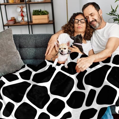 Couverture microfibre vache pour des soirées cocooning sur le canapé