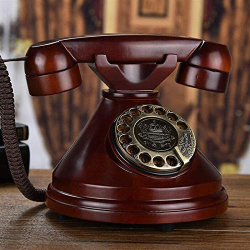 Téléphone rétro fixe antique filaire classique avec cadran et cloche en métal