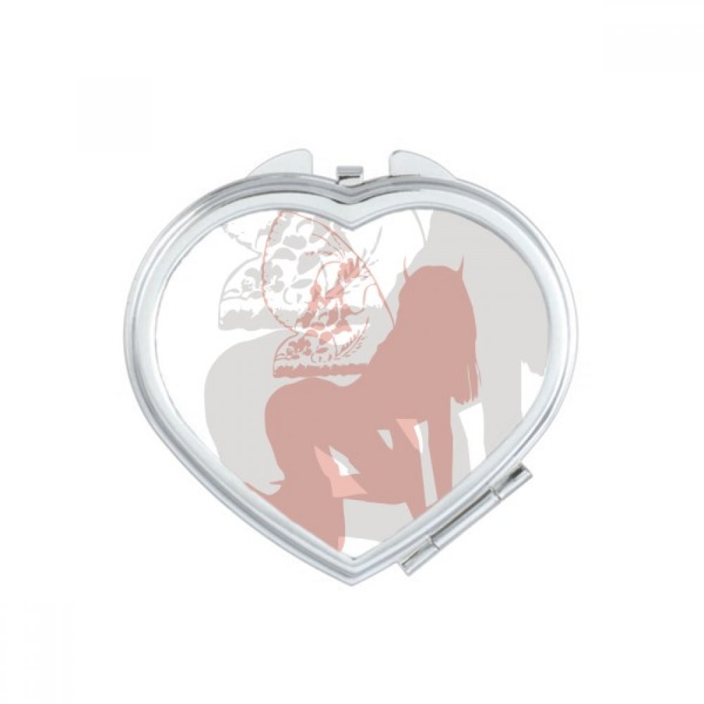 Miroir de maquillage portable cœur de poche à la main aux finitions soignées