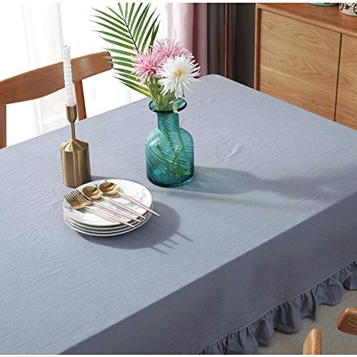 Nappe à pompons grand format pour protéger et habiller la table