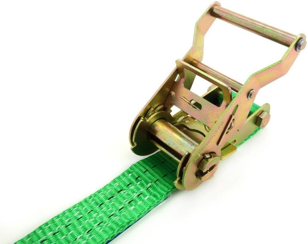 Close-up of the AMIO ratchet mechanism with green webbing threaded through the spindle, ready for tensioning.