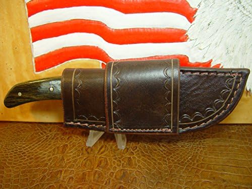 Leather Buck Generation 5 Cross Draw Knife Sheath. It is made of 10 oz Water Buffalo dyed dark brown with Tooled edgings. Can be worn on left or right side. Sheath only.