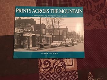 Paperback Prints Across the Mountain: A Photographic Trip Through the Pages of Time Book