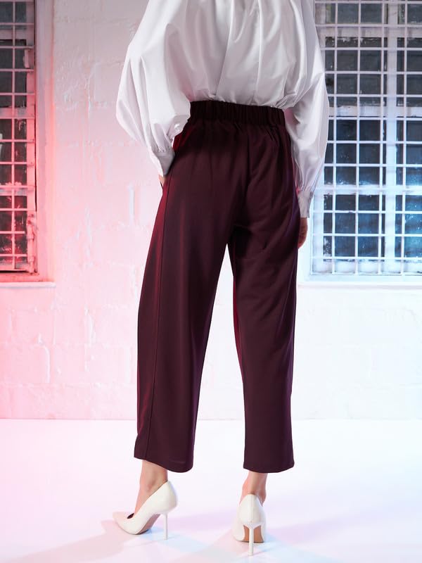 Image of SASSAFRAS Burgundy Button Hem Darted Balloon Pants