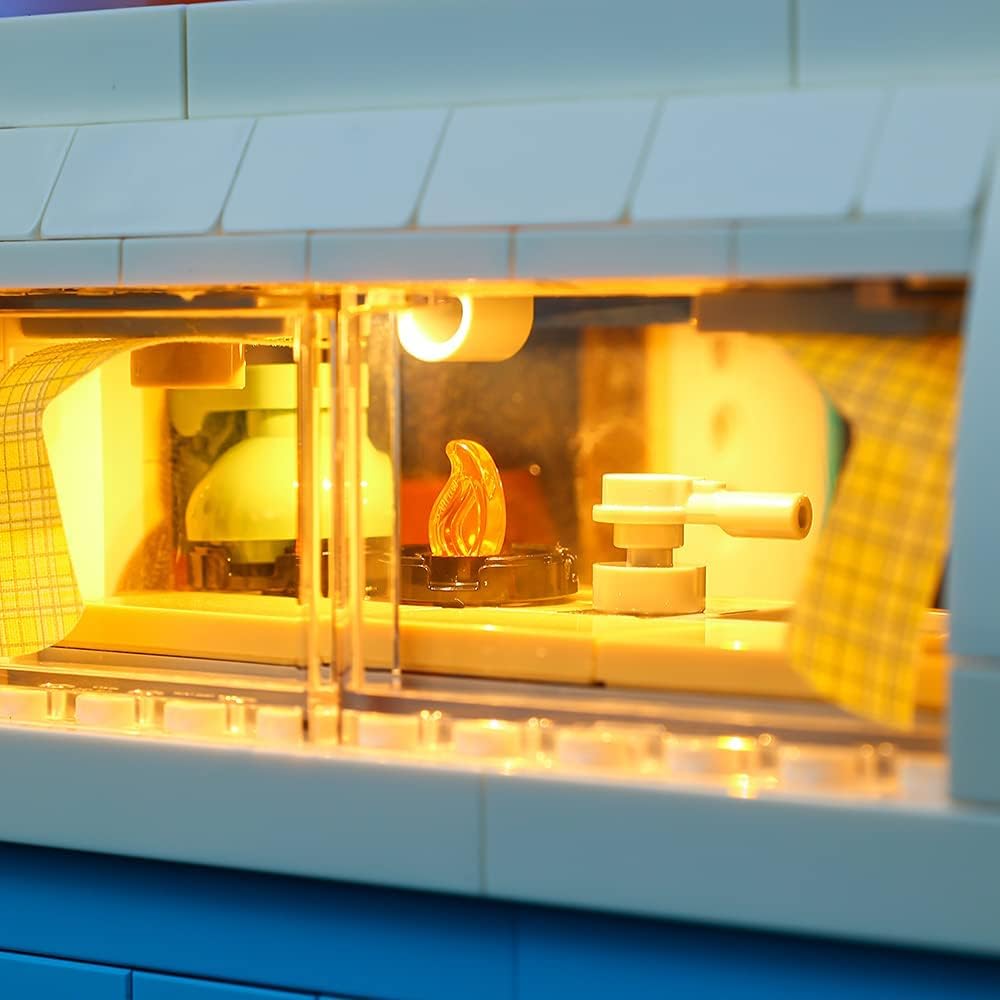 Close-up of the illuminated kitchen area interior of the Lego Volkswagen T2 Camper Van 10279